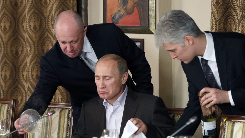 Yevgeny Prigozhin, the owner of the Wagner Group military company FILE - Businessman Yevgeny Prigozhin, left, serves food to Russian Prime Minister Vladimir Putin, center, during dinner at Prigozhin\'s restaurant outside Moscow, Russia, Friday, Nov. 11, 2011. Russia has engaged in under-the-radar military operations in at least half a dozen countries in Africa in the last five years using a shadowy mercenary force, Wagner, analysts say is loyal to President Vladimir Putin. The United States identifies Prigozhin as Wagner\'s financer. (AP Photo/Misha Japaridze, Pool, File)